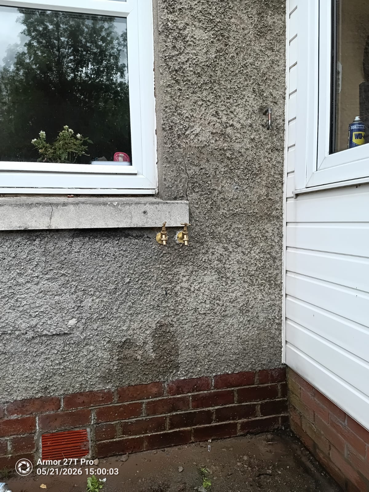 Outside tap installed on rendered wall